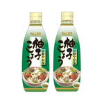 S & B Yuzu Kosho sauce bottles with Japanese and green chili, dry grocery product, vibrant labels and glass bottles.