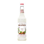 Bottle of Monin Almond Syrup 700ml for dry grocery, featuring a clear label and dark almond flavor liquid inside.