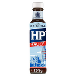 Heinz HP Sauce bottle in a grocery setting, showcasing the iconic brown sauce with label and cap.