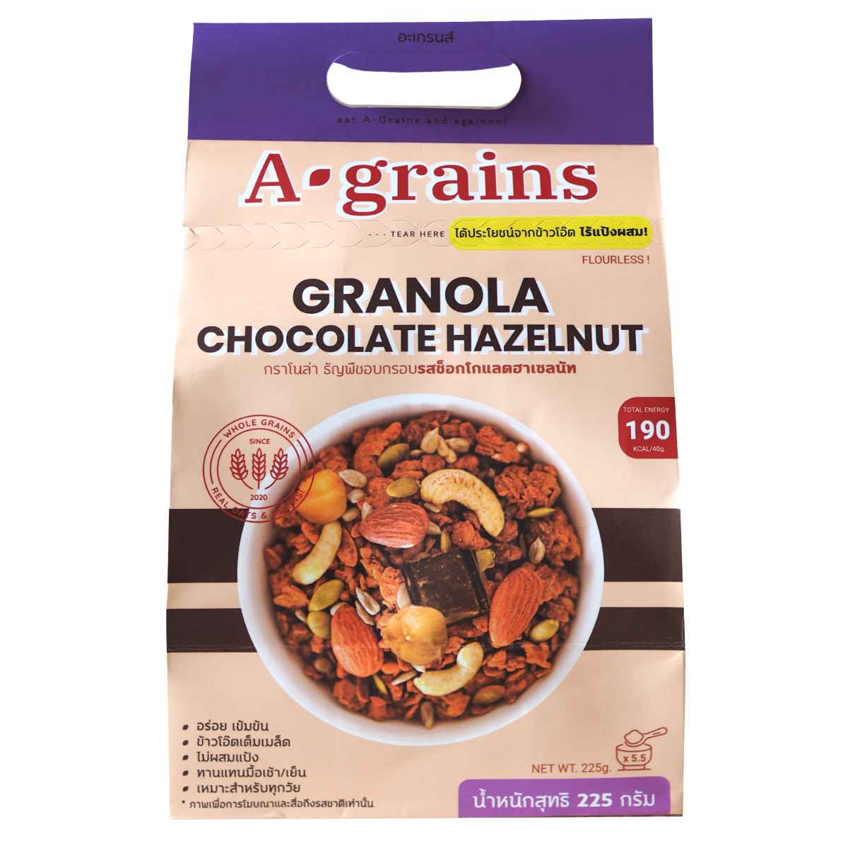 A Grains Chocolate Hazelnut Granola in a clear bowl, showing crunchy oats, chocolate pieces, and hazelnuts on a neutral background.