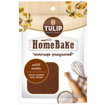 Dark brown Tulip Homebake cocoa powder in a container, used for making rich chocolate drinks.