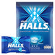 HALLS Mentho-Lyptus candies in a clear bowl, showing 100 pieces of menthol and eucalyptus lozenges for soothing relief.