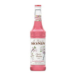 Bottle of MONIN Cherry Blossom Syrup 700ml for dry grocery use, featuring cherry blossom flavor in a clear plastic bottle.