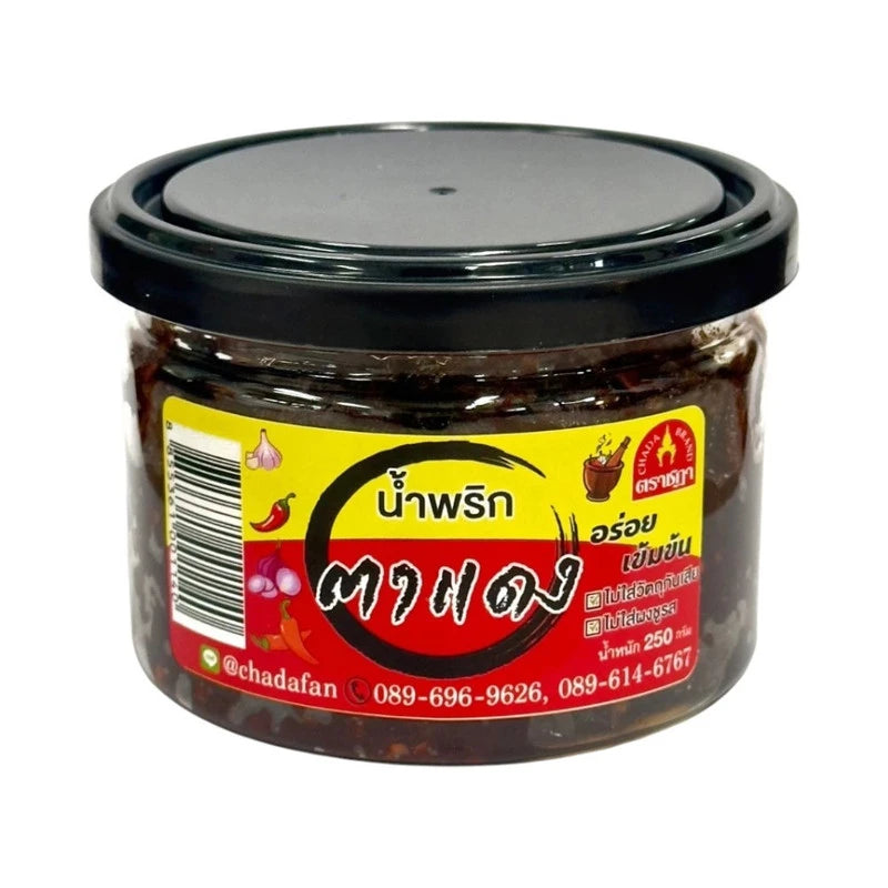 Chada Nam Prik Ta Daeng Red Chili Paste jar with label, showcasing vibrant red chili paste inside.