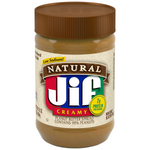 Creamy Jif Natural Peanut Butter jar with label, showcasing its smooth texture and brand logo on a grocery shelf.
