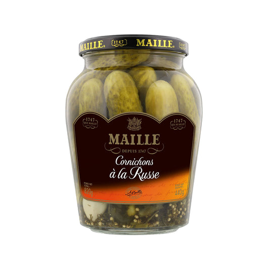 Jar of Maillee Cornichons à la Russe with small pickled cucumbers in a clear glass jar, ready for grocery shopping.