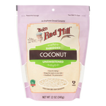 Unsweetened shredded coconut from Bob's Red Mill, healthy grocery product, showing shredded coconut in a clear container.