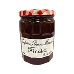 Jar of Bonne Maman Strawberry Jam 750g with a classic label, featuring fresh strawberries and a red lid, on a grocery shelf.