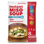 A bowl of Mirukome Instant Miso Soup with tofu, featuring a steaming bowl of miso soup with tofu cubes and green onions.