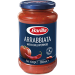 Jar of Barilla Arrabbiata Sauce with red chili pepper label, showcasing spicy tomato pasta sauce in a grocery store setting.