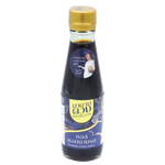 Bottle of Madametuang Premium Oyster Sauce for cooking, featuring a clear label and dark brown liquid inside a glass bottle.
