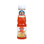 Deksomboon Chili Sauce 165g jar, spicy Thai dry grocery product with red chili peppers and traditional sauce texture.
