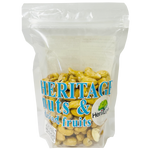 Heritage Raw Hazel Nut, a confectionery snack, featuring a close-up of fresh raw hazelnuts in natural light.