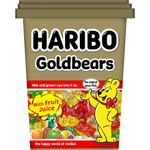 Colorful Haribo Gold Bears confectionery snacks in a clear bowl, showcasing bright gummy bear candies on a white background.