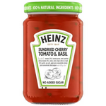 Heinz Sundried Cherry Tomato and Basil grocery jar with sun-dried cherry tomatoes and fresh basil leaves inside.