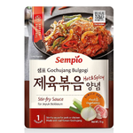 Sempio Gochujang Bulgogi stir-fry sauce jar with spicy red chili paste and ingredients visible in the image.