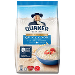 A bowl of Quaker Quick Cook Oatmeal in a white bowl with a spoon, showcasing the quick and easy breakfast option.