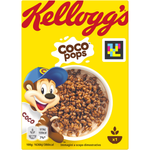 Bowl of Kellogg's Corn Pop cereal with milk in a white bowl on a wooden table, showcasing the crispy golden corn puffs.