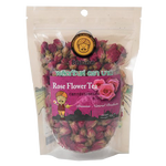 A glass of Baboo Rose Flower Tea with fresh rose petals and blooming rose flowers, served in a clear glass.