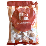 Sainsbury's Dairy Fudge pieces in a clear bowl, showcasing creamy, smooth confectionery snacks with rich dairy flavor.