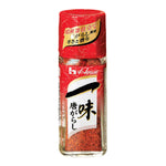 House Foods Red Pepper Mix in a clear container, showcasing vibrant red chili flakes for adding spice to dishes.