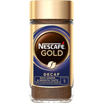 Nescafe Gold Decaf Coffee drink in a clear glass with a frothy top and coffee beans in the background.