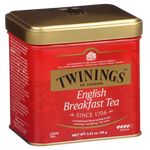 Twinings English Breakfast Tea drink in a glass with tea bags and a teapot, showcasing the iconic Twinings tea brand.