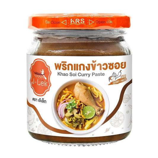 J-LEK Khao Soi curry paste in 195g jar, showing the spice-filled container for authentic Thai cooking.