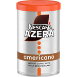 A cup of Nescafe Azera Americano coffee drink in a clear glass, showcasing the dark coffee and foam on top.