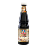 Deksomboon Thick Oyster Sauce 670g jar, showcasing the rich, dark sauce with a smooth, glossy texture in a clear glass container.