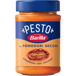 Dried Barilla Pomodori Secchi (sun-dried tomatoes) in a clear container, showcasing their deep red color and wrinkled texture.