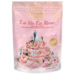 Diamond Grains Granola with strawberries and rose, featuring crunchy oat grains in a close-up view of the grocery product.
