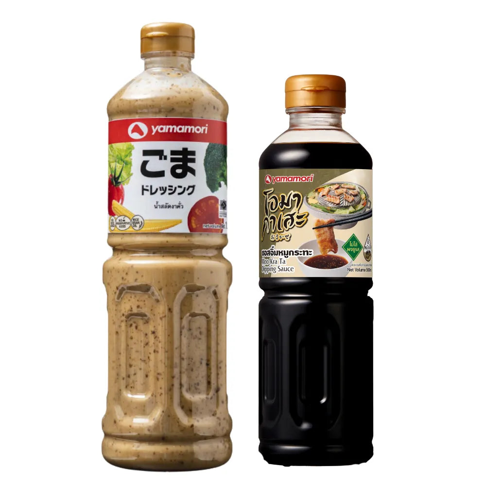 YAMAMORI Roasted Sesame Salad Dressing and Moo Kra Ta Dipping Sauce bottles, 1L and 500ml, with labels and sauce near the bottles