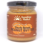 Sunshine Creamy Dark Peanut Butter jar with label, smooth texture visible in a grocery product image.
