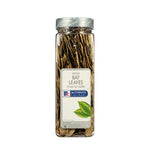 Dried bay leaves in a jar from MCCORMICK, used for cooking and flavoring in dry grocery recipes.