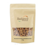 Raw almonds from Radiance Wholefoods, natural confectionery snack with whole, unroasted almonds in a clear container.