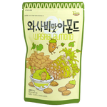 Toms Wasabi Almond confectionery snacks in a clear bowl, showcasing crunchy almonds coated with spicy wasabi flavor.