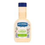 Bottle of Hellmann's Plant-Based Real Caesar Salad Dressing showing the label and salad ingredients inside the transparent bottle.