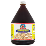 DEK SOM Boon Oyster Sauce 2.3kg bottle in a dry grocery store, showcasing the large plastic container with the label visible.