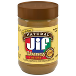 Jif Natural Creamy Peanut Butter with Honey in a jar, showing smooth peanut butter with honey swirl and label.