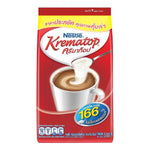 Nestle Krematop coffee cream powder drink in a glass, showing the creamy beverage with a smooth, frothy surface.