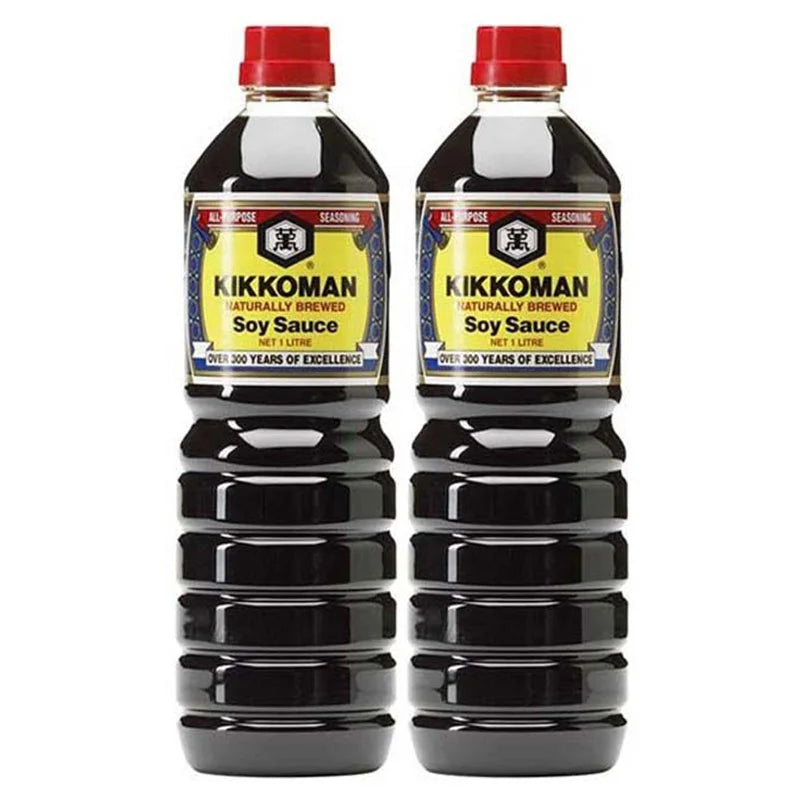 Kikkoman soy sauce bottles, 1 liter each, side by side, featuring the Kikkoman brand label and dark soy sauce liquid inside