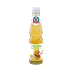 Deksomboon Plum Sauce 350g bottle, traditional Thai dry grocery condiment with rich, tangy flavor in clear glass bottle