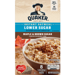 Quaker Instant Oatmeal packet featuring Maple & Brown Sugar flavor with low sugar content, displayed on a grocery shelf.