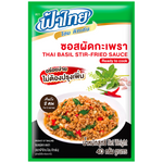 Fathai Thai Basil Stir Fried Sauce in a jar, showcasing the product label with fresh basil illustrations on a grocery shelf.