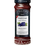 Jar of St.Dalfour France grape jam with a clear label, showcasing fresh grapes and fruit preserves in a glass jar.