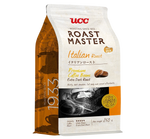 Ucc Italian Roasted Coffee drink in a glass, showcasing dark coffee with a frothy top and a coffee bean garnish.