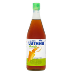 Squid brand fish sauce in a clear bottle, used for Asian cuisine and cooking, with a dark liquid inside.