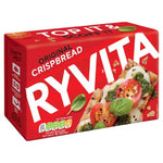 Ryvita Original Crispbread, crunchy whole grain snack from Ryvita, shown stacked on a white plate with a knife.