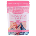 Kurera Fine Grain Himalayan Pink Salt in a clear container, showcasing the light pink, coarse salt grains on a grocery store shelf.